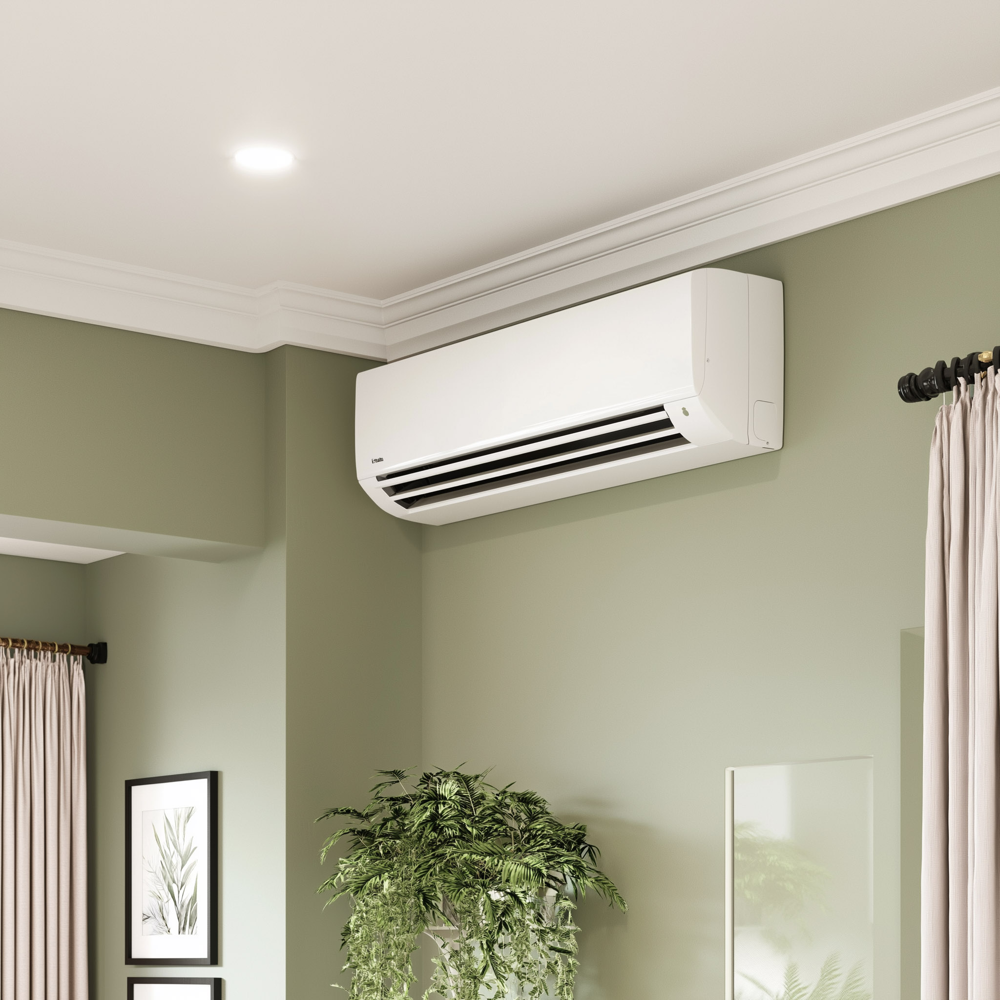 White wall-mounted air conditioner installed near the ceiling in a modern room with green walls, moldings, pale curtains and decorative plants